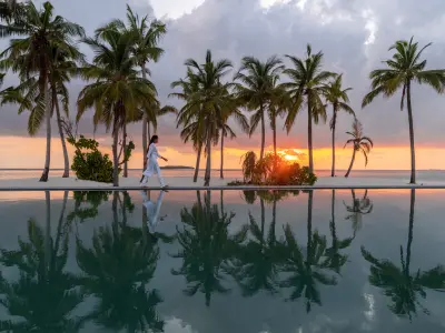 Alila Kothaifaru Maldives - Infinity Pool with Sunset