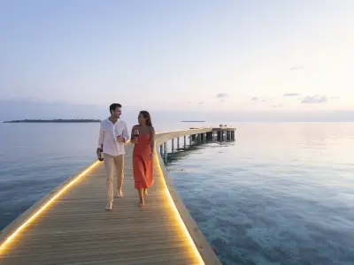 Emerald Faarufushi Resort & Spa couple walk