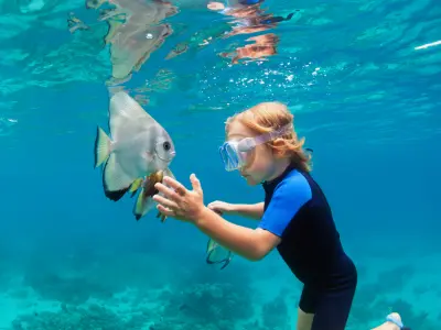 Emerald Faarufushi Resort & Spa Kids Interaction with Bat Fish