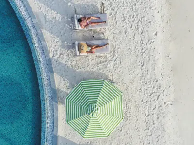 Couple Velaa Bar Aerial - Le Méridien Maldives Resort & Spa