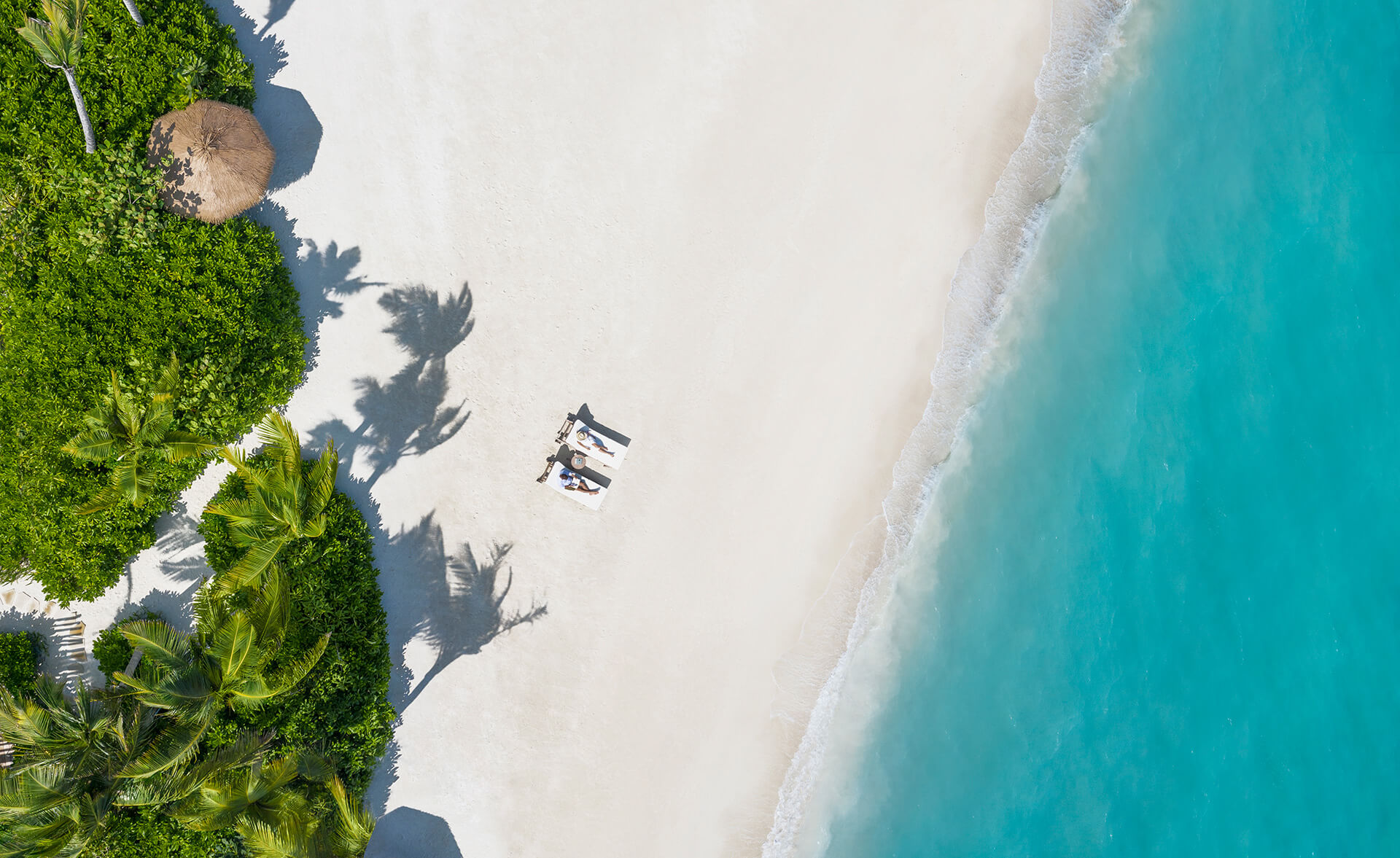 Couple on the Beach Waldorf Astoria Maldives Ithaafushi