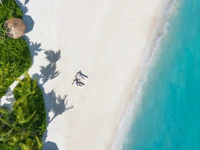 Couple on the Beach Waldorf Astoria Maldives Ithaafushi